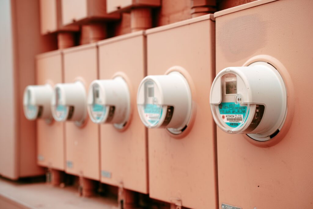 Row of industrial electricity meters used to track energy consumption and cost savings