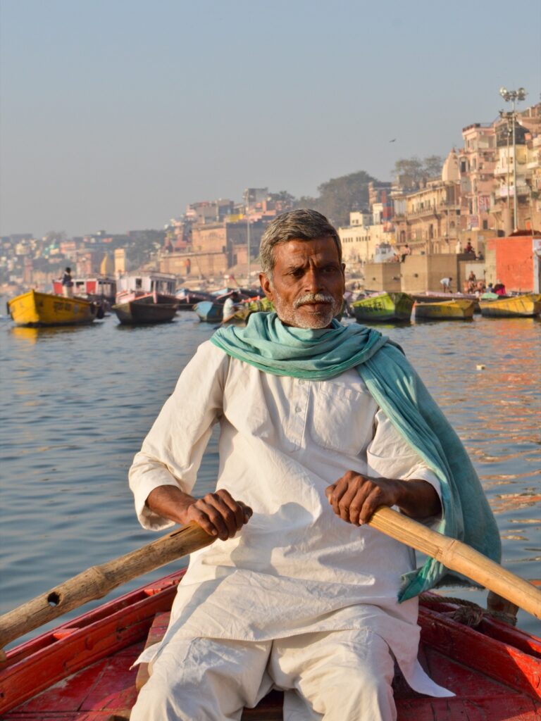 Boatman on the Ganga at Varanasi ghats — the river that Namami Gange aims to restore to health