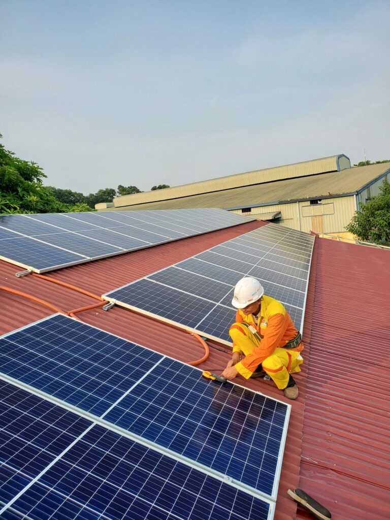 Rooftop solar panel installation representing small-scale net-metering and open-access solar projects in India