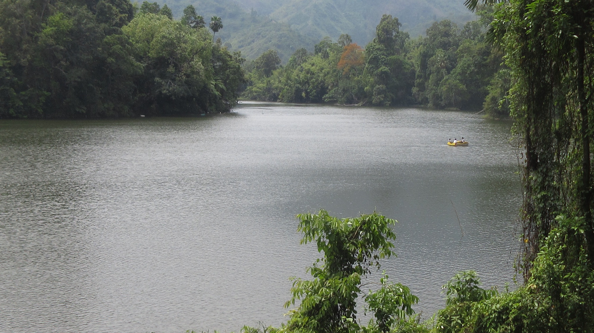 A pristine Himalayan lake in Arunachal Pradesh surrounded by dense forest