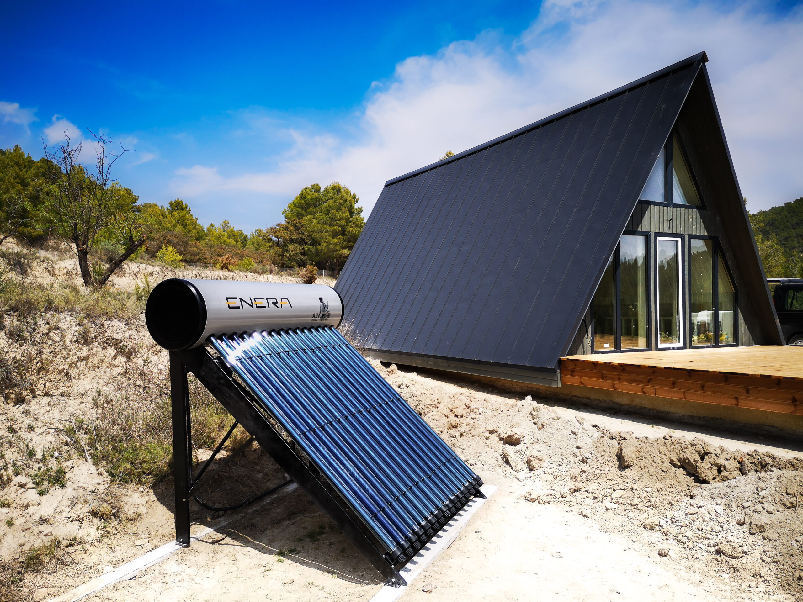 Evacuated tube collector (ETC) solar water heater with rows of vacuum glass tubes mounted on a stand