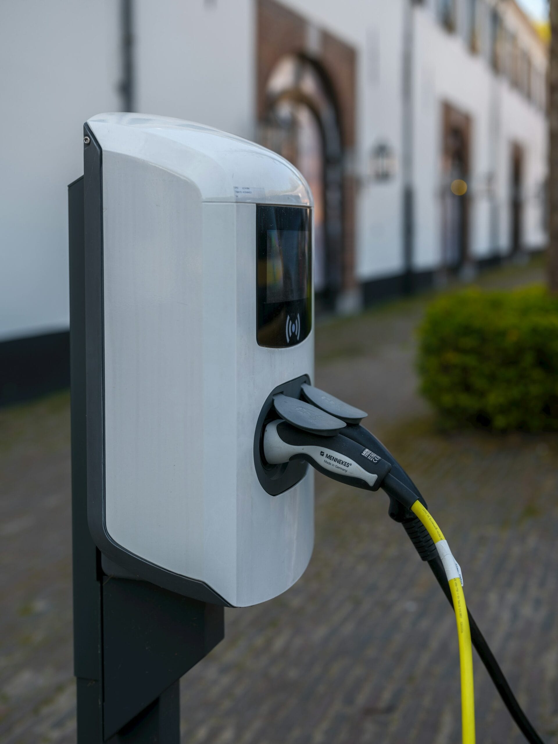 Public AC electric vehicle charging station with connector plugged in, India EV charging infrastructure