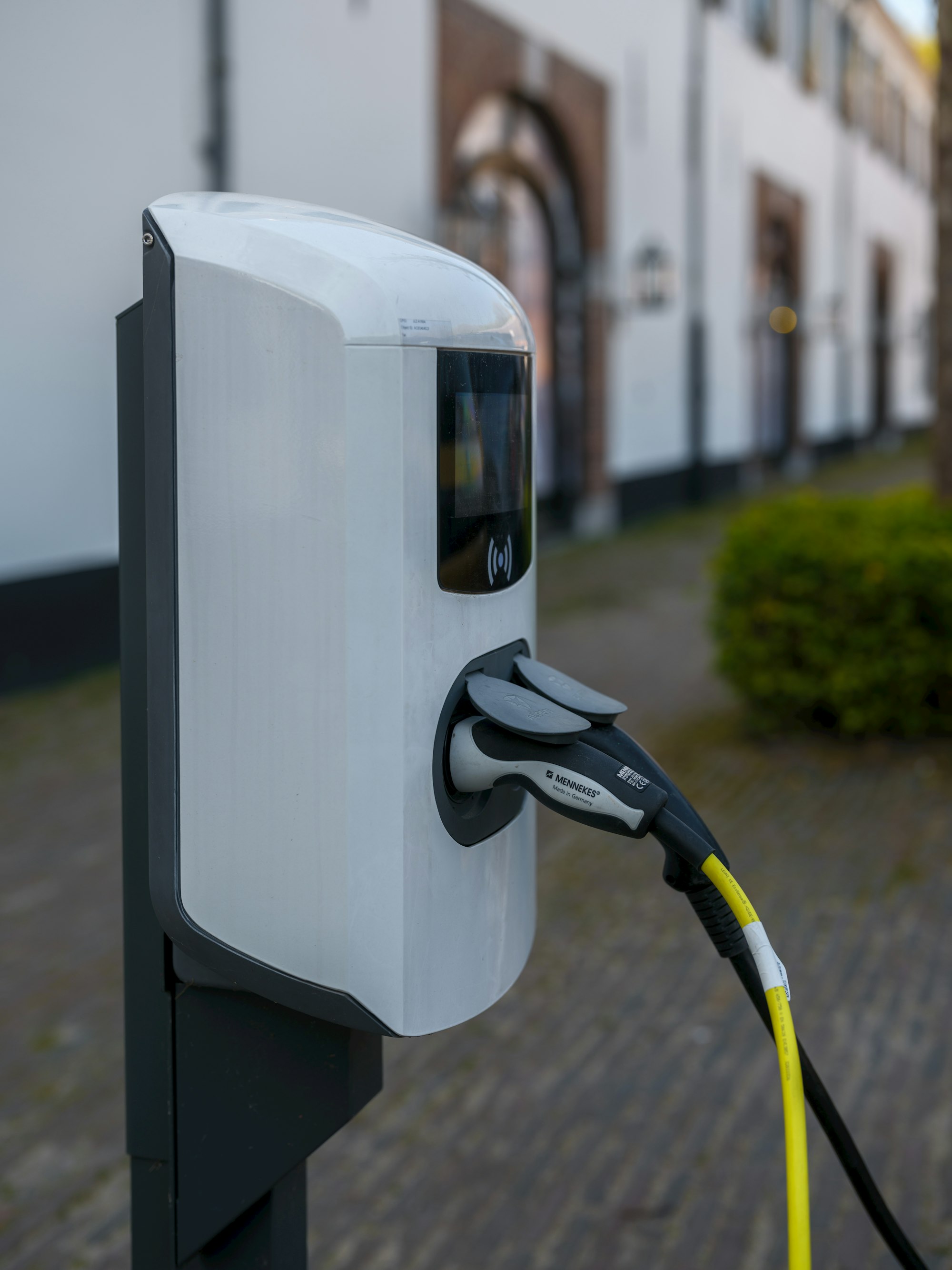 Public AC electric vehicle charging station with connector plugged in, India EV charging infrastructure