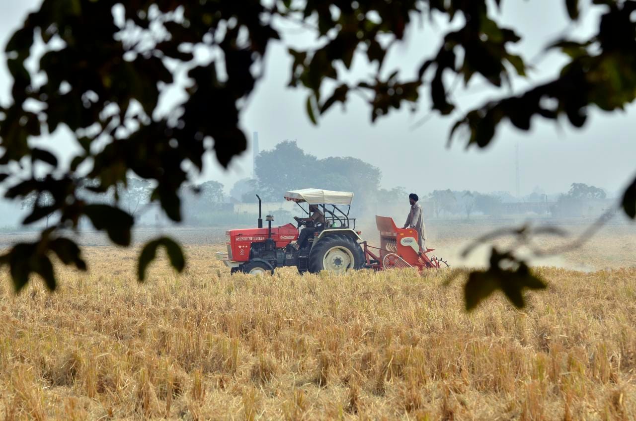 Tractor sowing wheat in a Punjab field without burning rice stubble, a soil carbon practice
