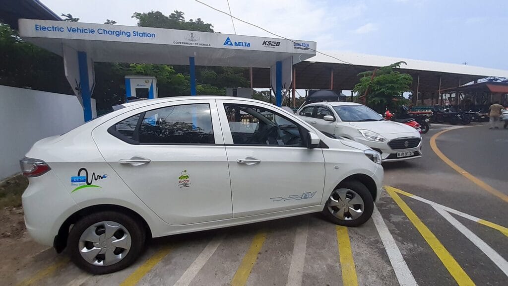 Electric car parked at a public EV charging station in Thiruvananthapuram, relevant to CAFE-III fuel economy norms