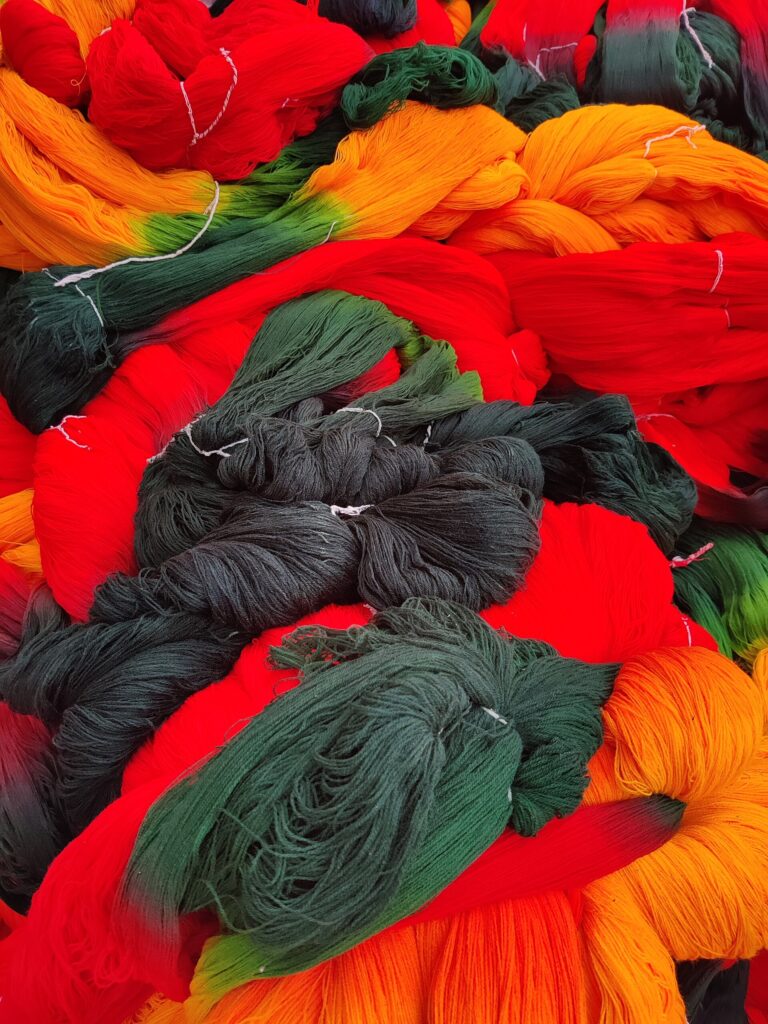 Brightly dyed yarn skeins, the kind of textile dyes targeted by new dye wastewater treatment research in India
