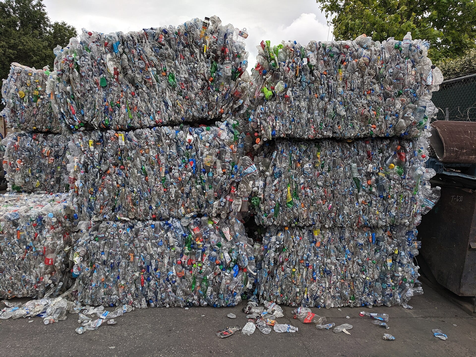 Stacked bales of compressed PET bottles, a circular economy recycling example